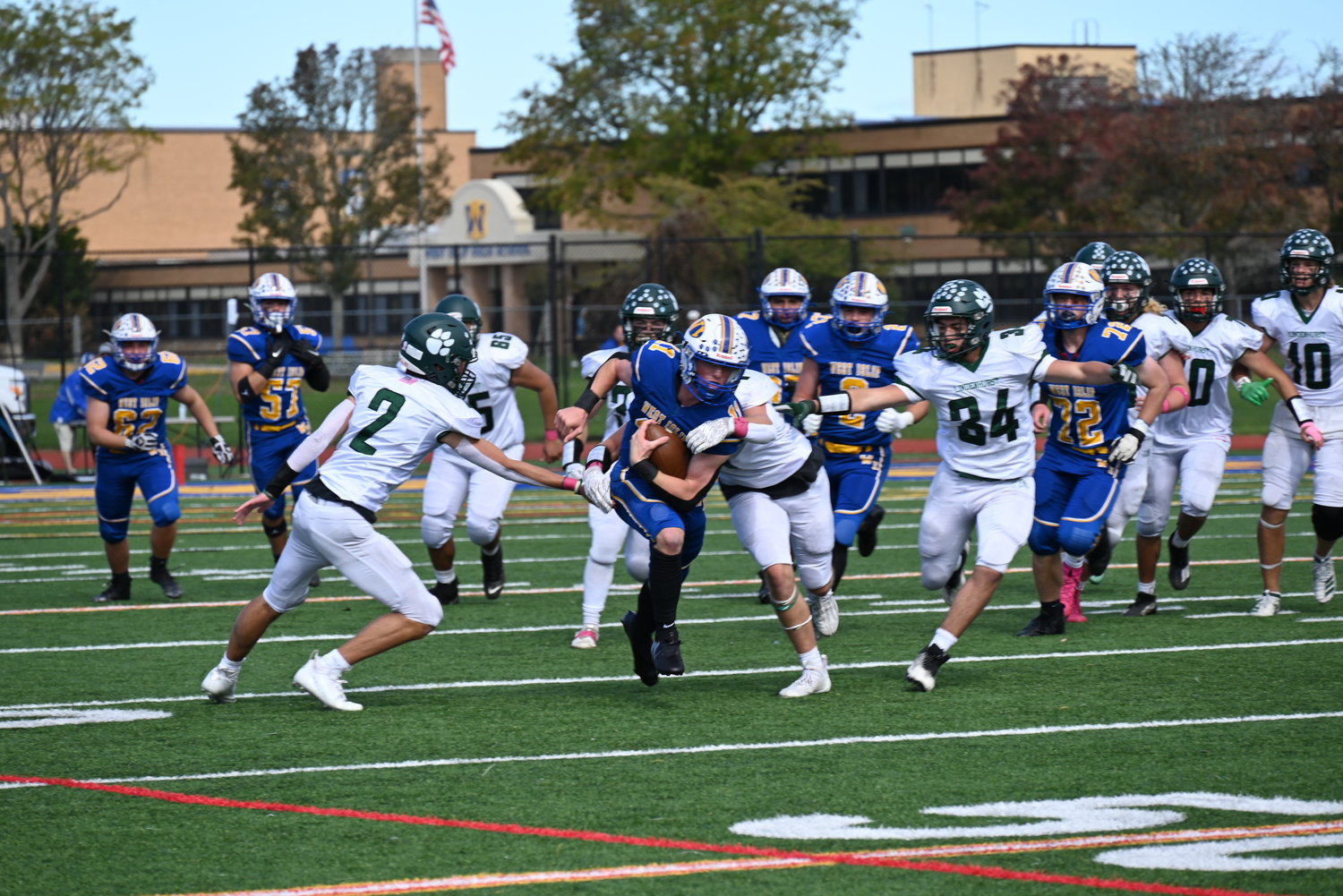 West Islip’s Patrick Keenan runs the ball against Lindenhurst during the Lions’ homecoming game on October 8. West Islip fell to the Bulldogs 7-13.